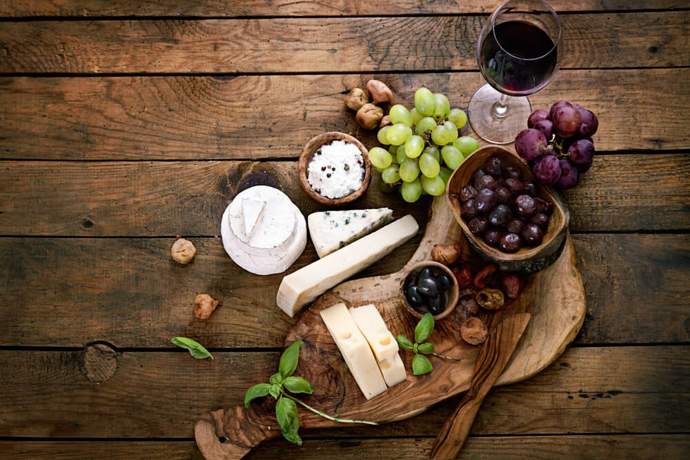 Cheese variety. Food background. Fresh ingredients on wood